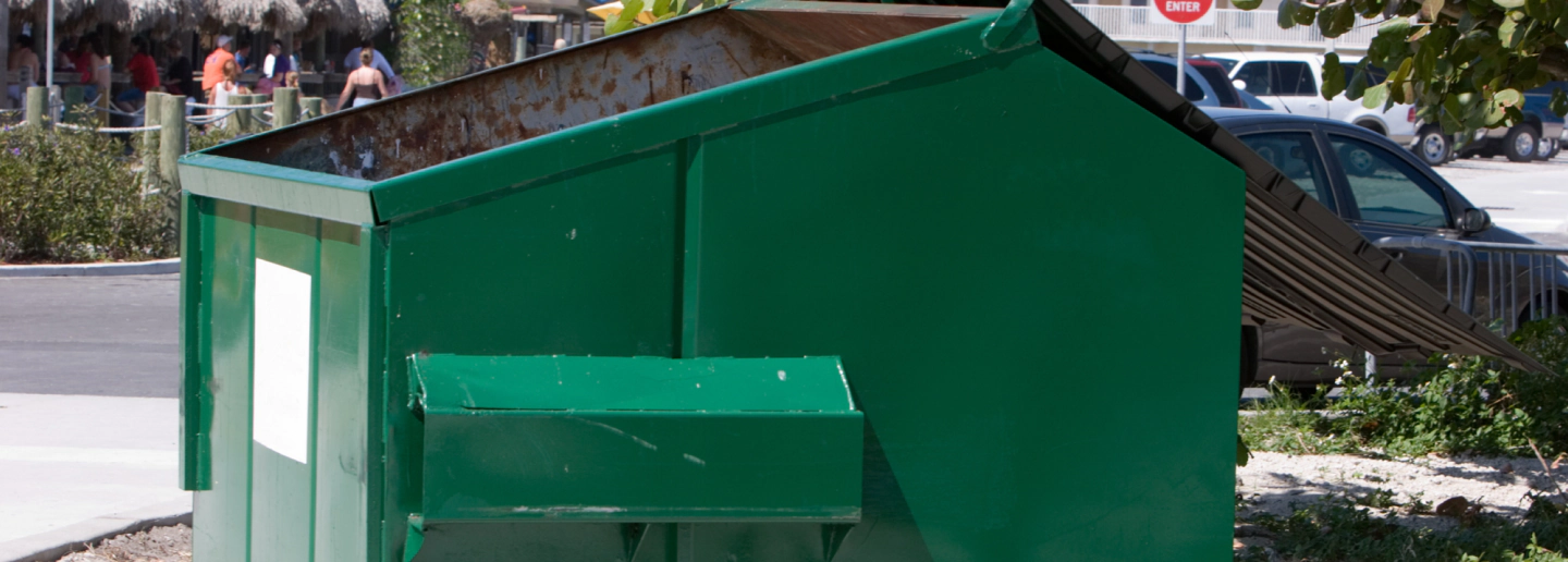 dark green dumpster closeup
